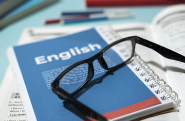 english book with glasses table i