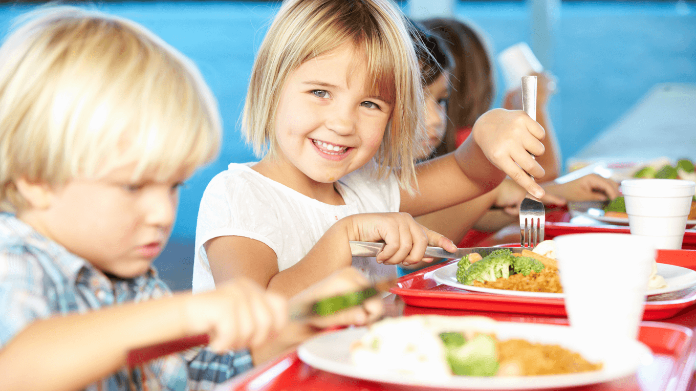 pupils enjoing meal